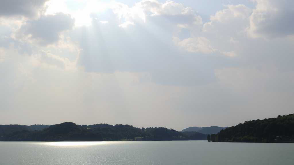 a calm lake reflecting the clouds in a peaceful landscapejpeg
